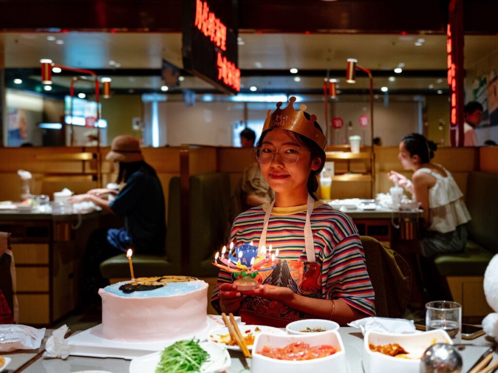 A girl celebrating birthday in top restaurant in Toronto