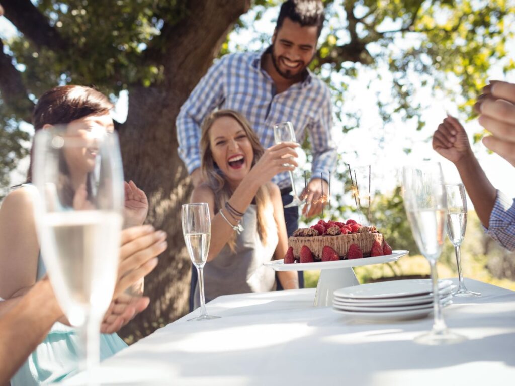 People celebrating outdoor restaurant birthday in Toronto