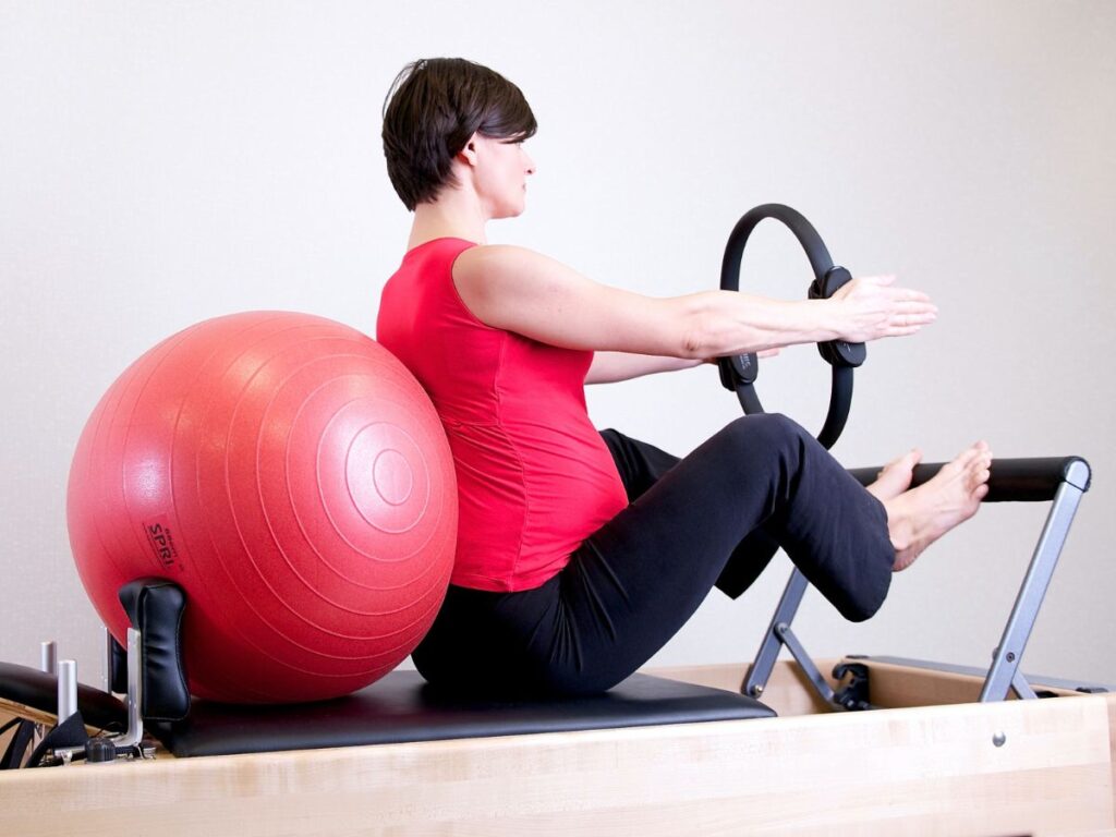 WOMAN DOIng pilates