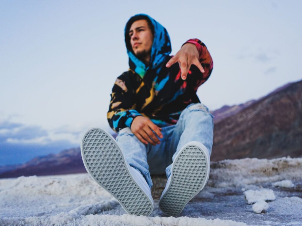 Boy wearing modern streetwear clothes on a mountain in Toronto.