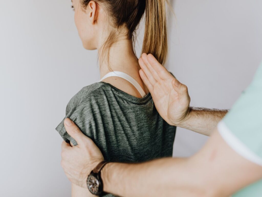 woman being treated by her chiropractor