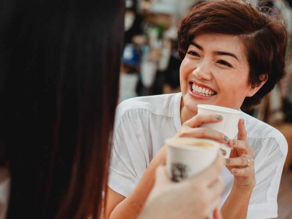 girls enjoying coffee on streets