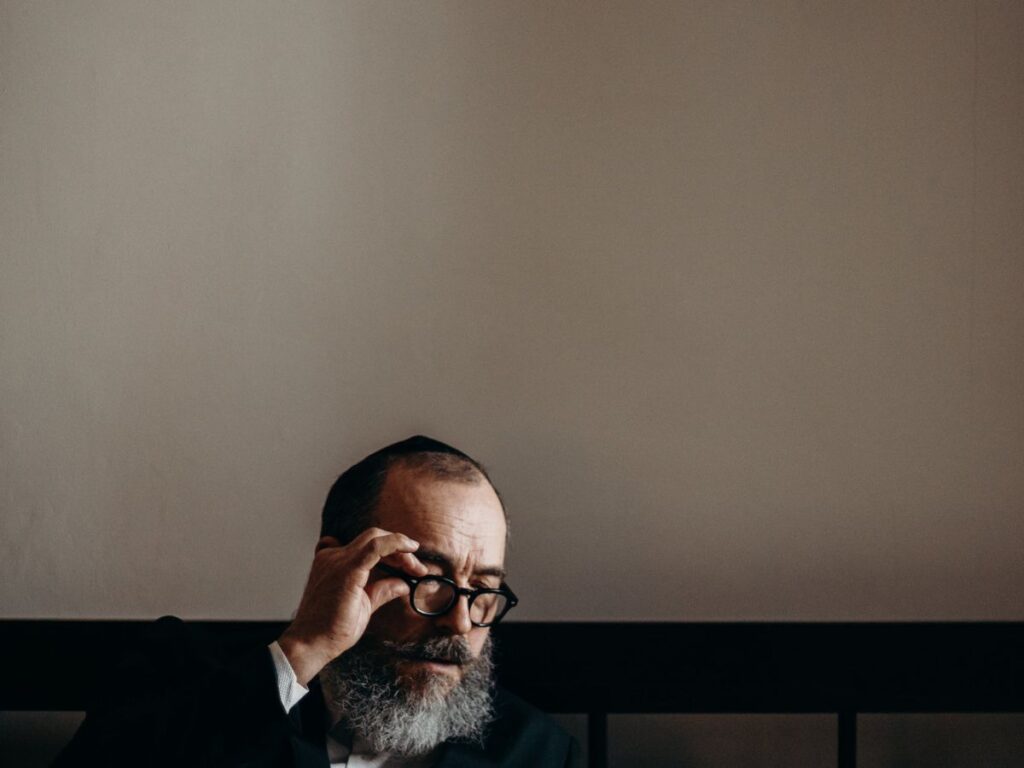 man setting his eyeglasses