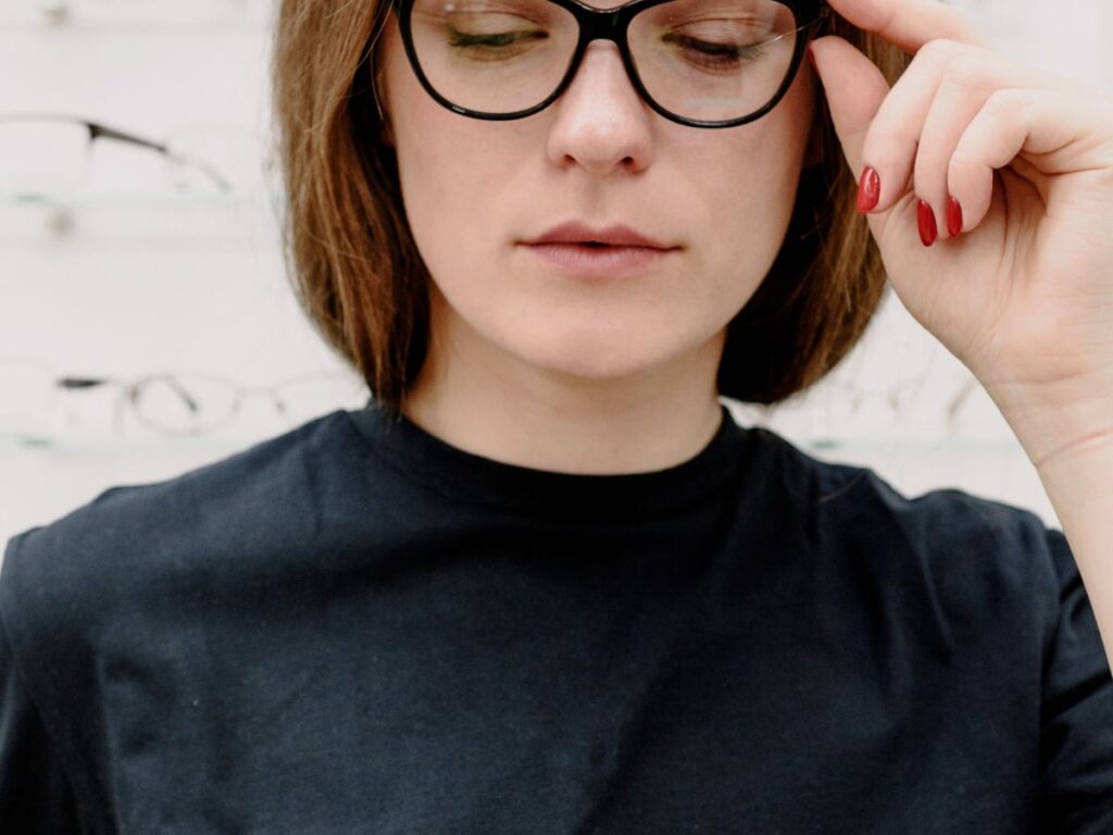 woman setting eyeglasses