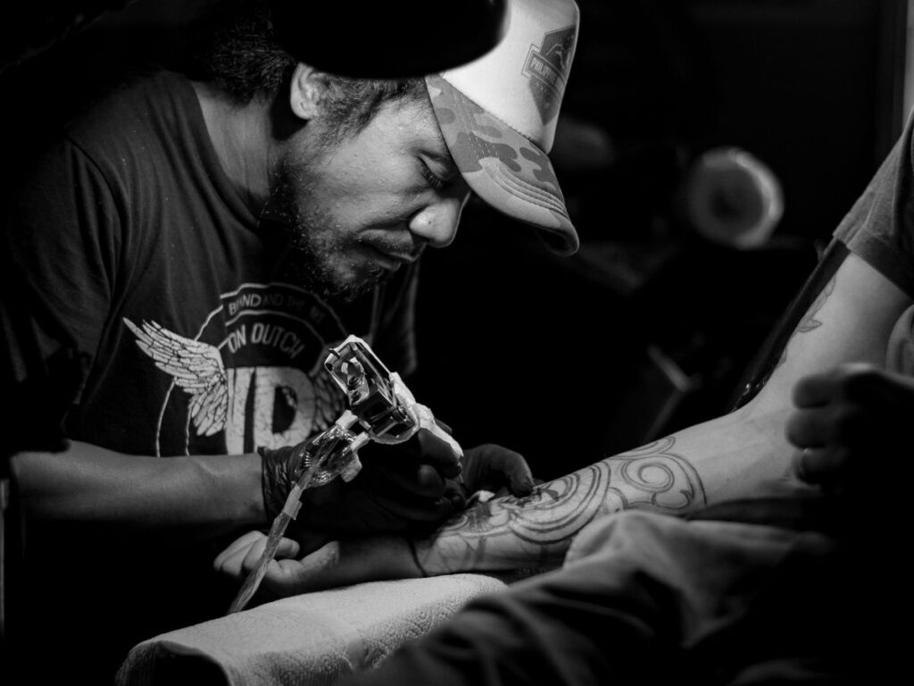 tattoo artists at work in toronto