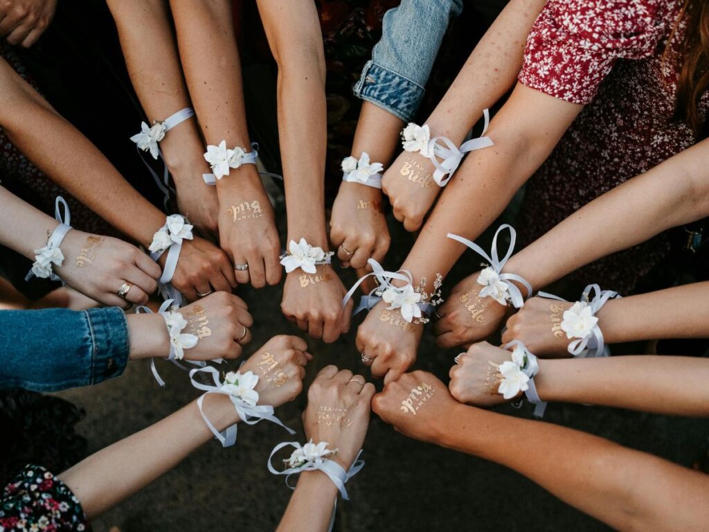 bride squad with bows on hands