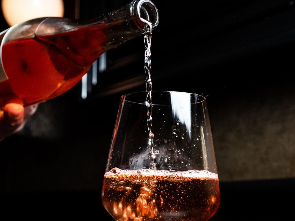 pouring wine in glass