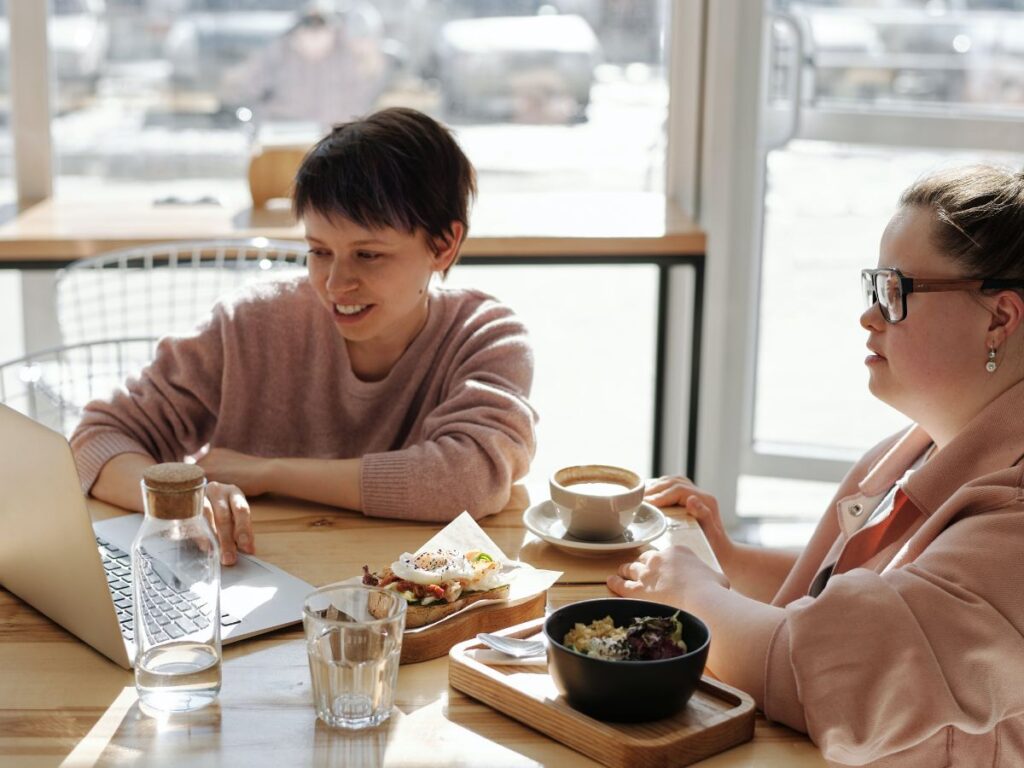 women in cafe with laptop