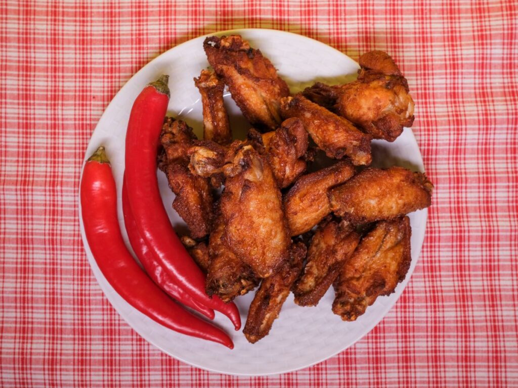 chicken wings with red chilli in plate