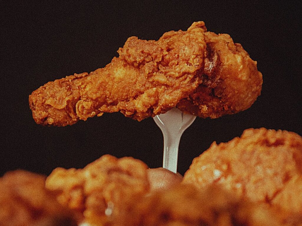 chicken wing on a fork