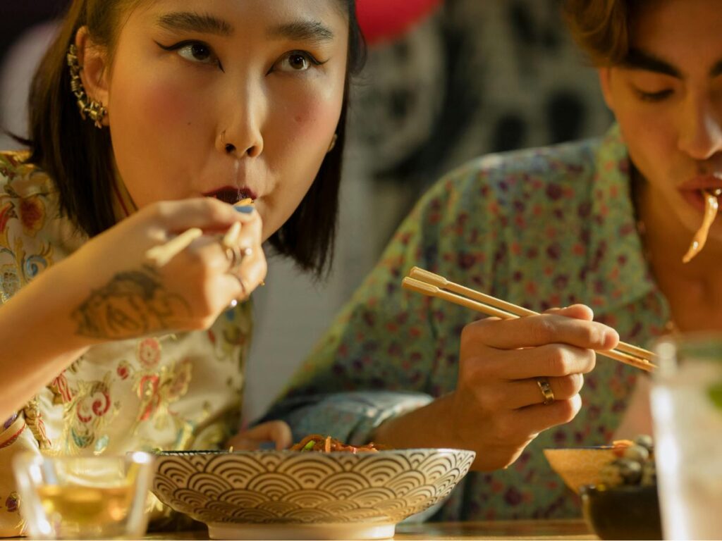 woman eating chinese food