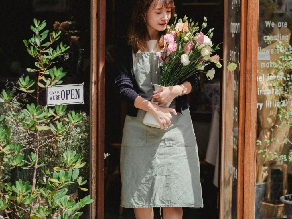 woman carrying flower bouquet