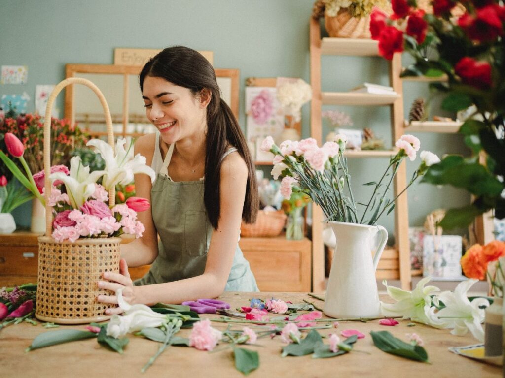 woman setting up a bouquet