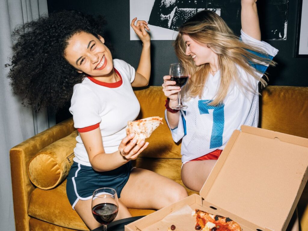 girls enjoying pizza