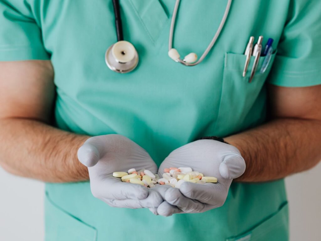 doctor carrying tablets