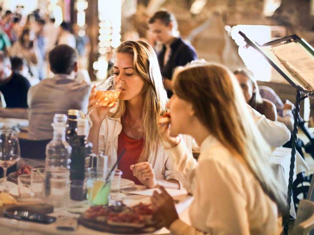 girls eating food in a restaurant