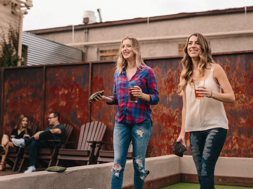girls enjoying drinks on a rooftop bar