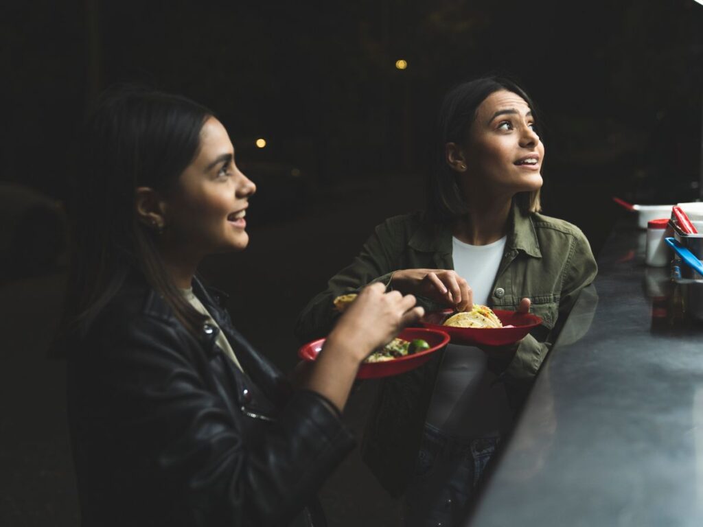 girls eating tacos