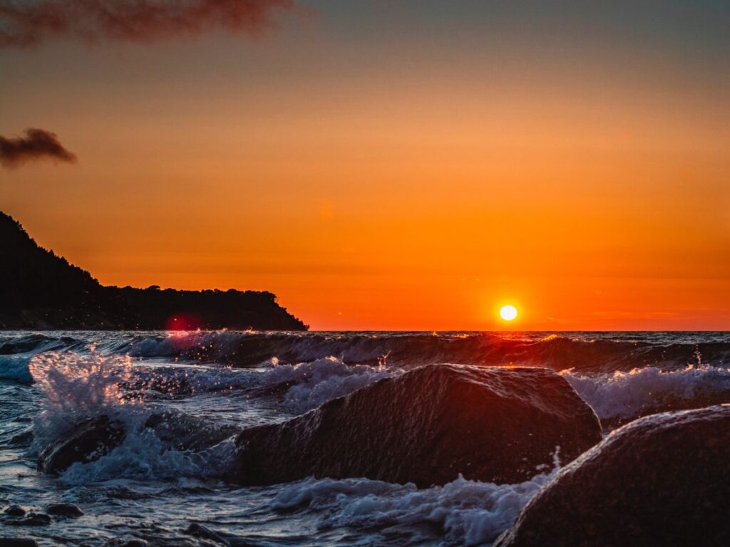 sunset with waves in sea