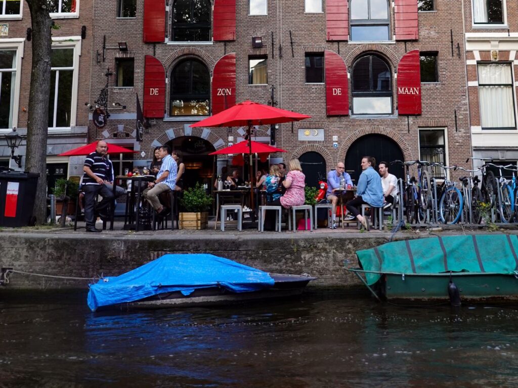 people in restaurant with water view