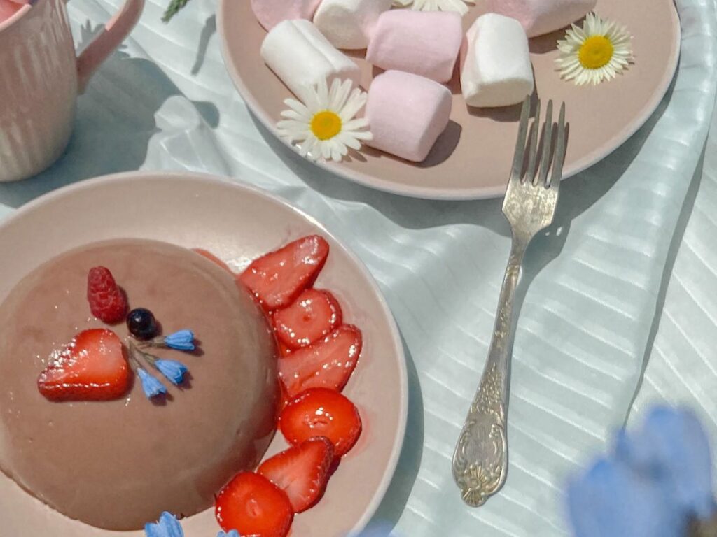 chocolate cake with marshmallows and strawberry sides