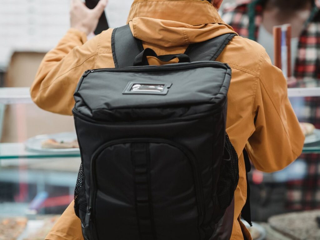 man wearing a travel bag