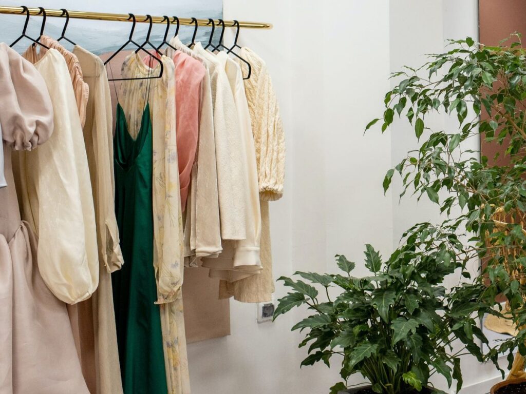 dresses in hangers in a shop