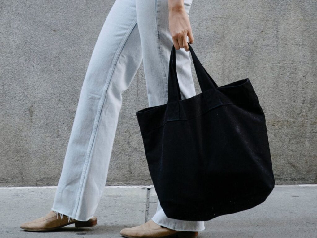 woman carrying a fabric handbag