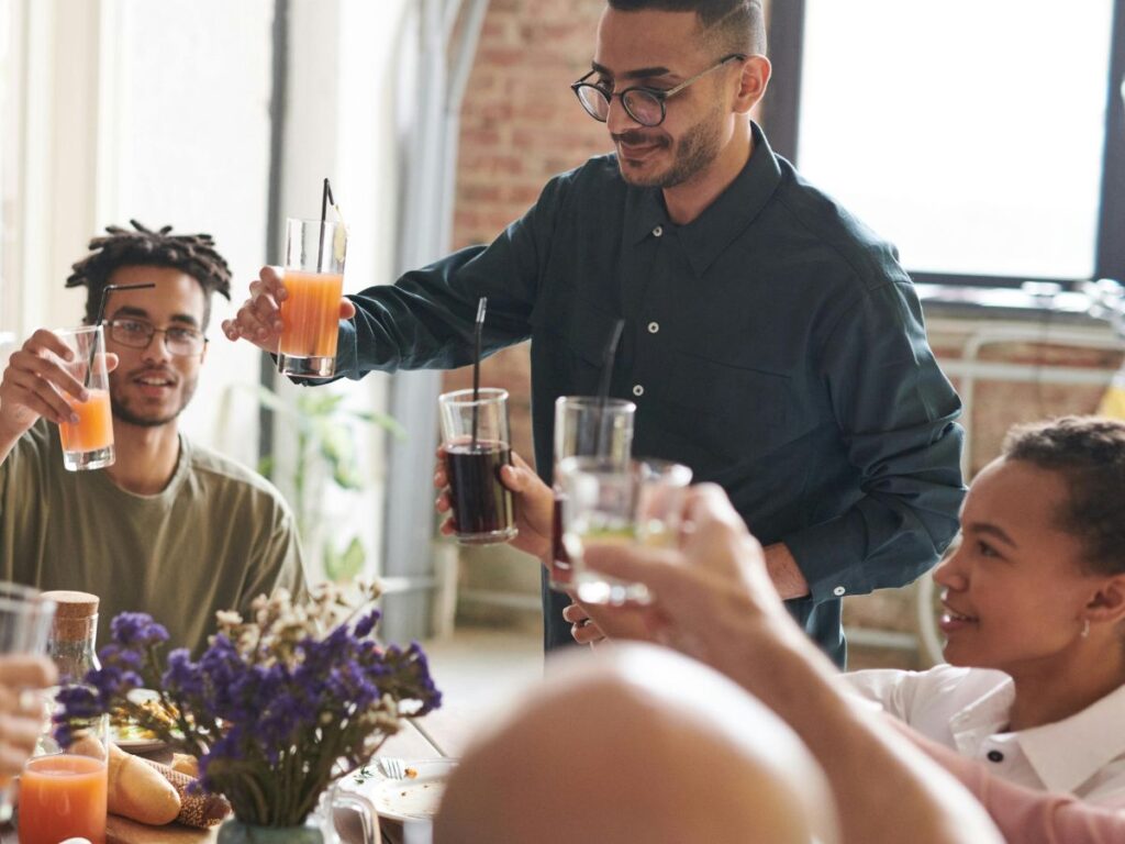 group of people in a restaurant cheering