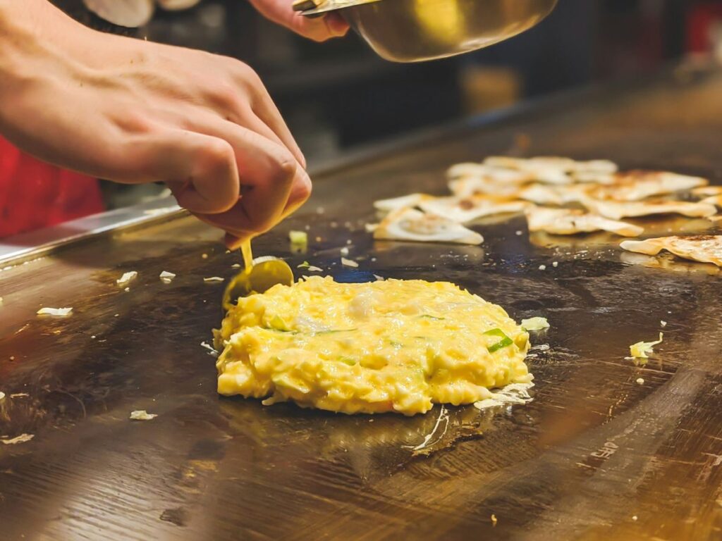 cooking okonomiyaki