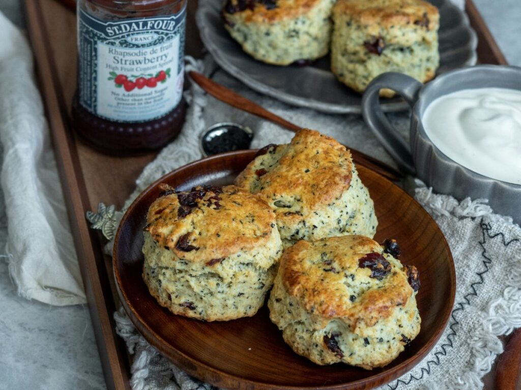 scones with jam in a tray