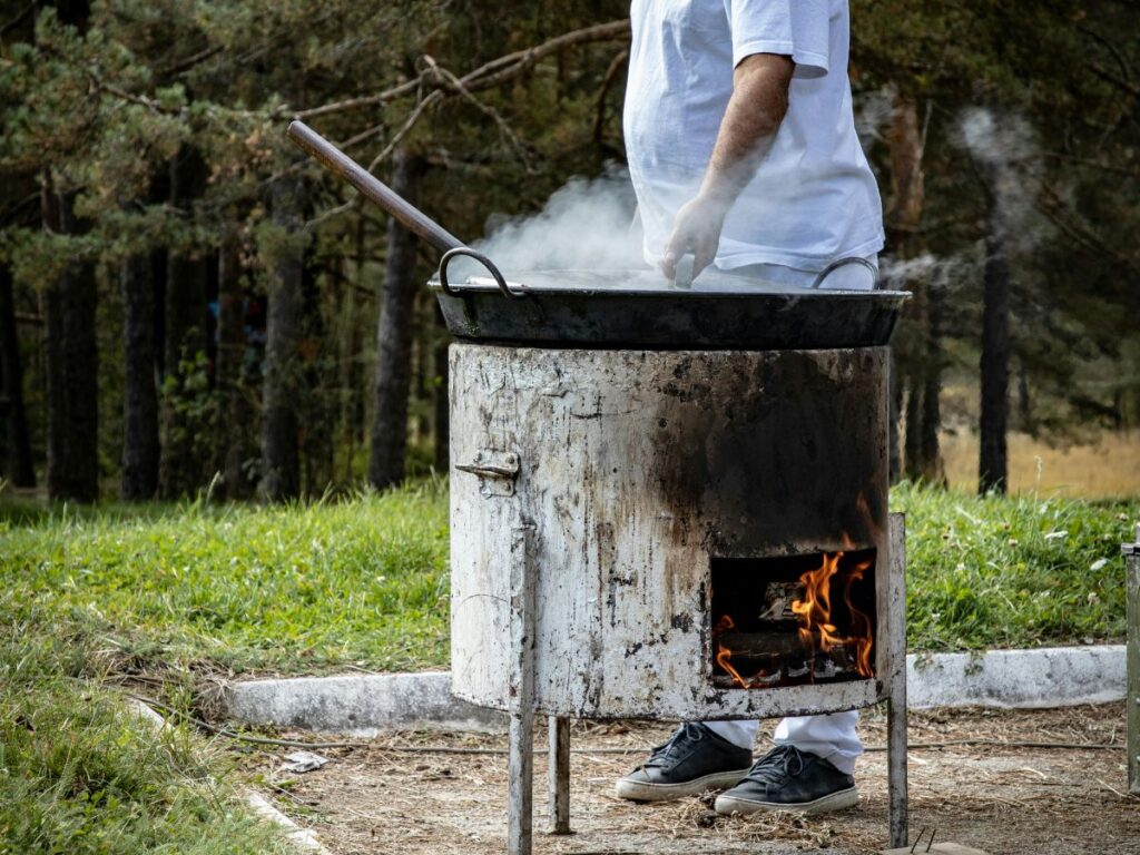 man on a bbq pit