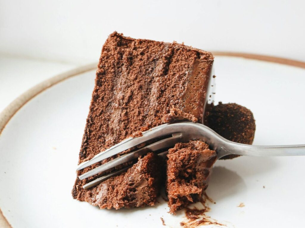 cutting a slice of chocolate cake