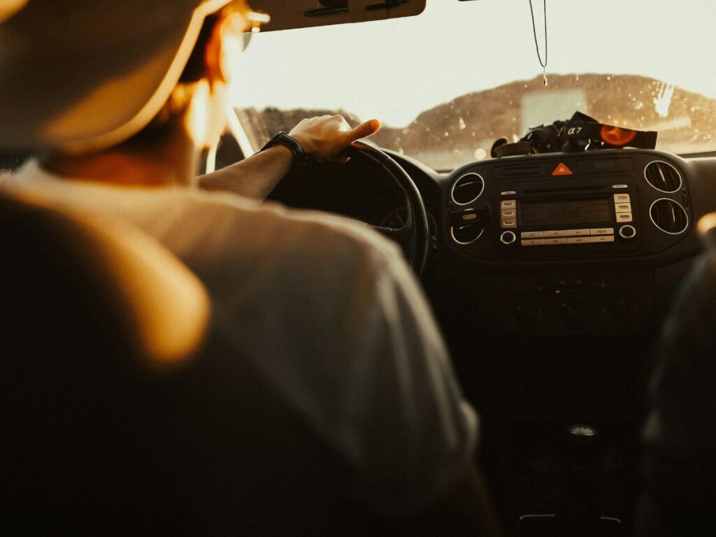 man driving car