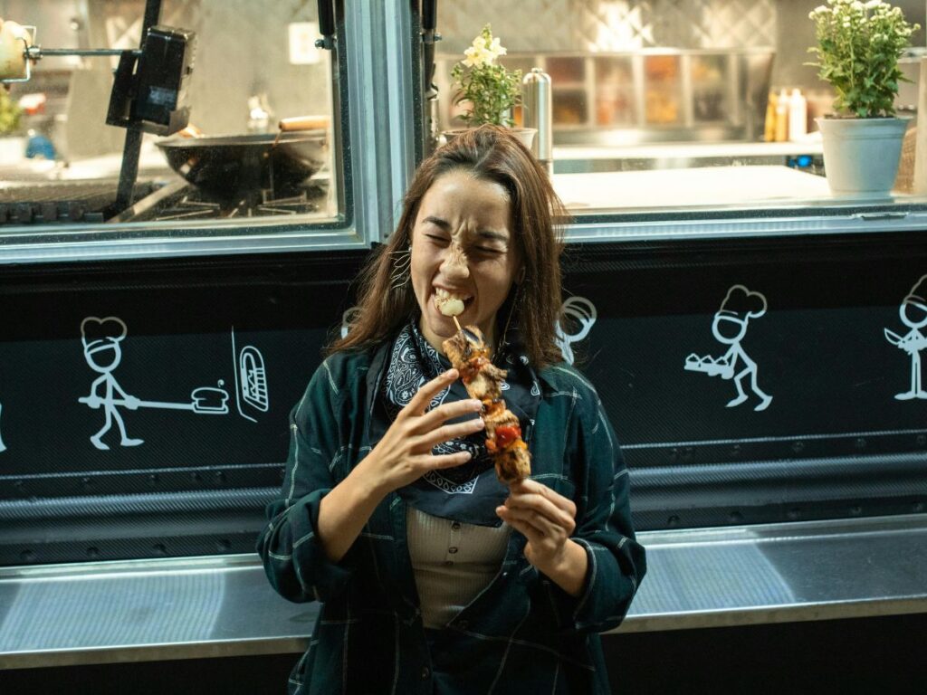 woman eating kebab