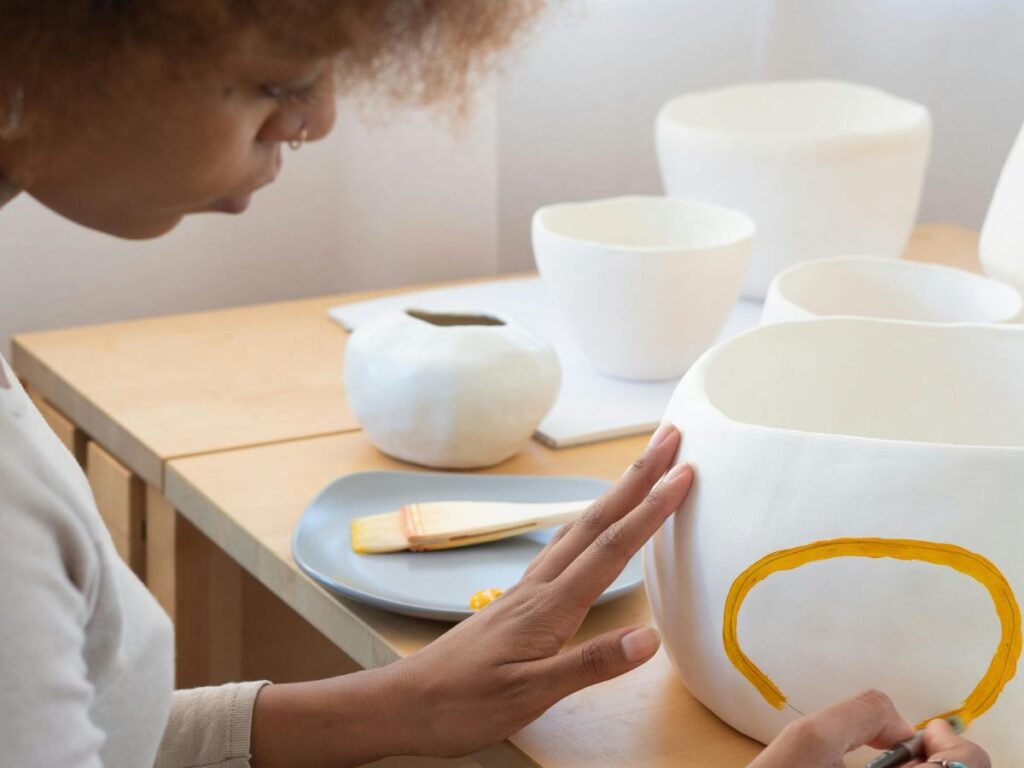 woman painting pots