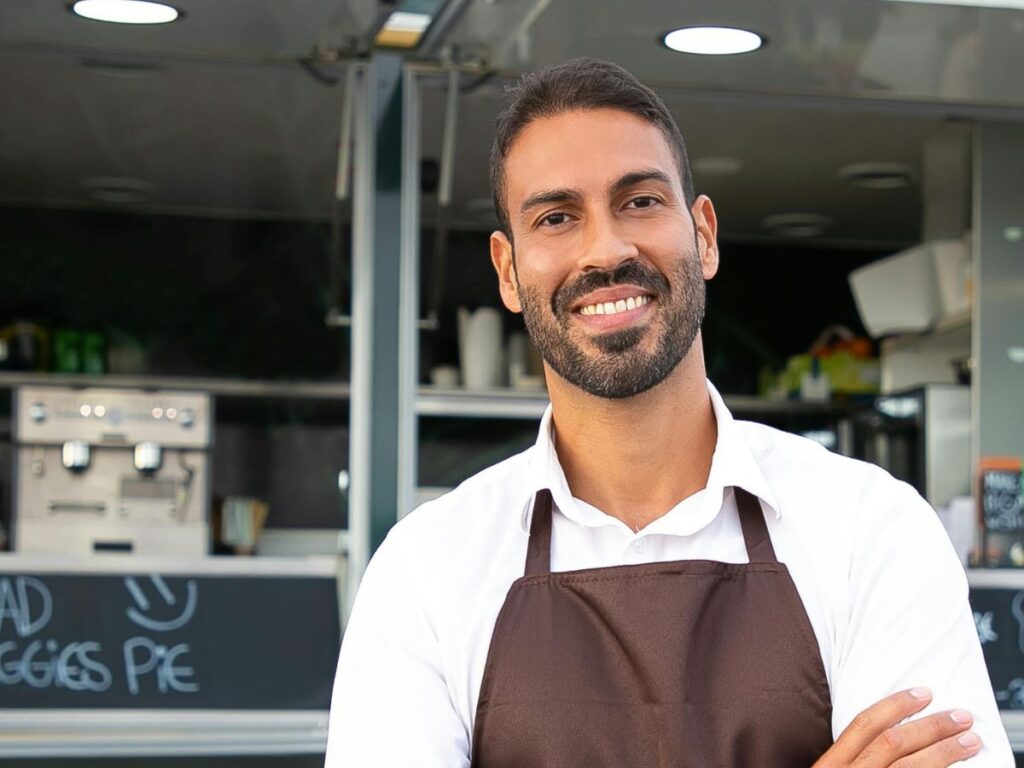 man in front of his food truck