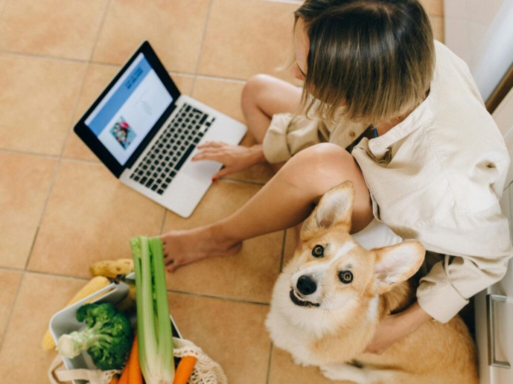 woman sitting with her pet dog