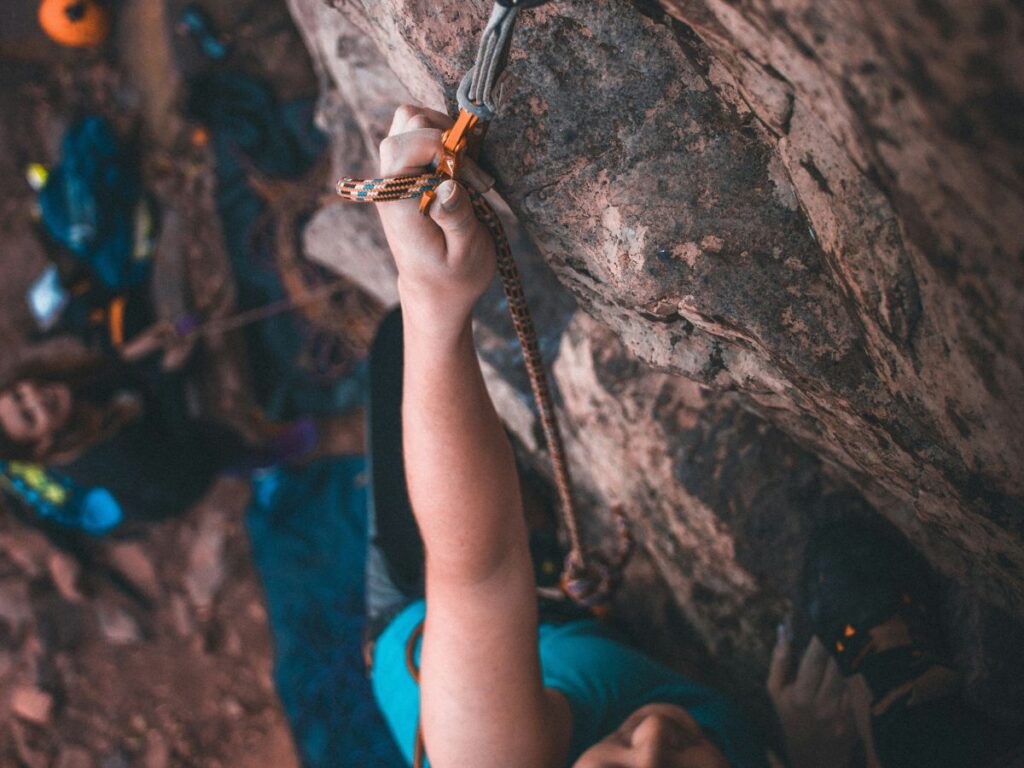 climbing on rock with ropes