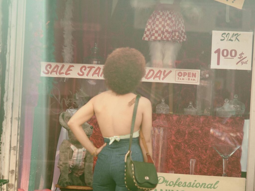 woman standing outside vintage store