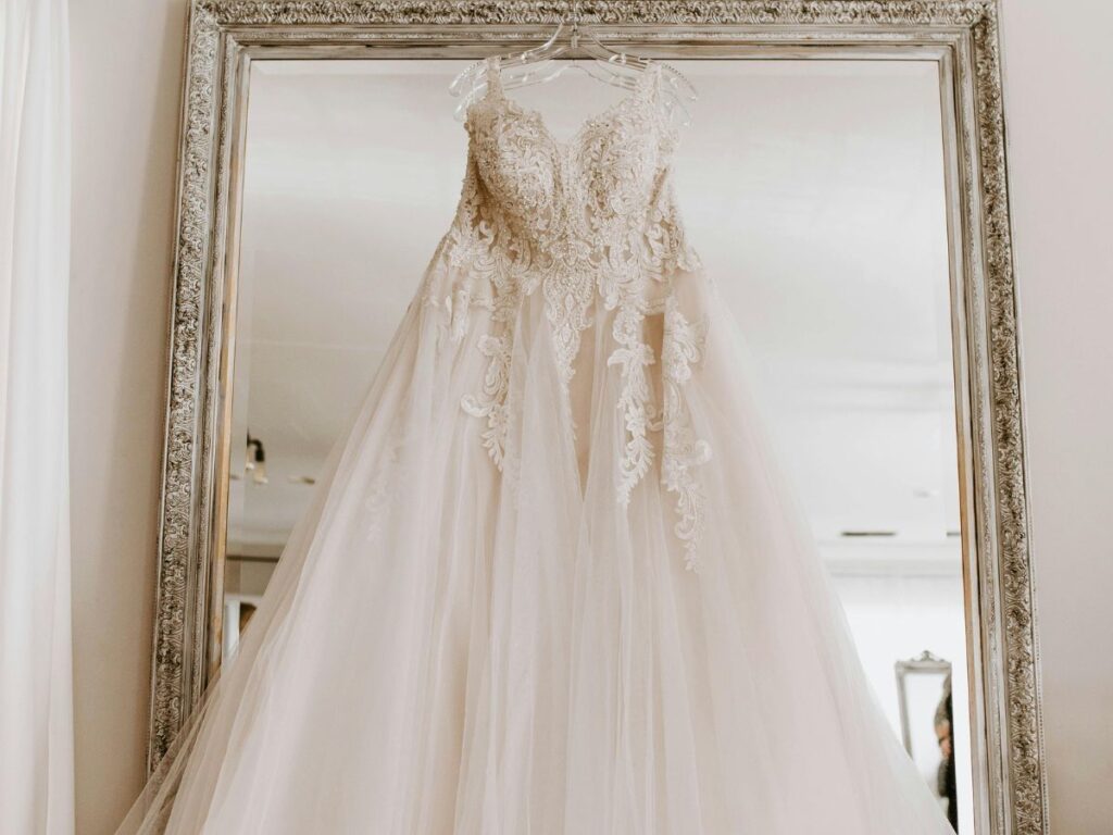 bridal dress hung in a  hanger