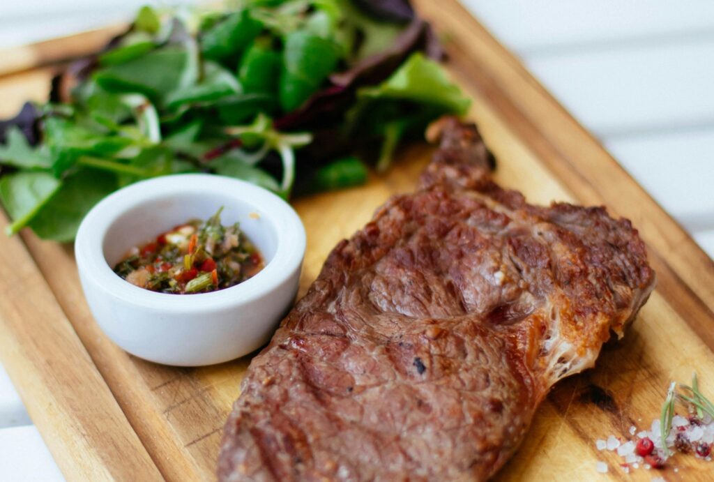 steak served with vegetables