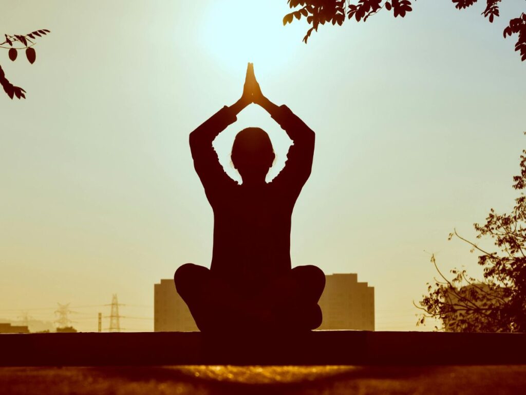 woman meditating in open air