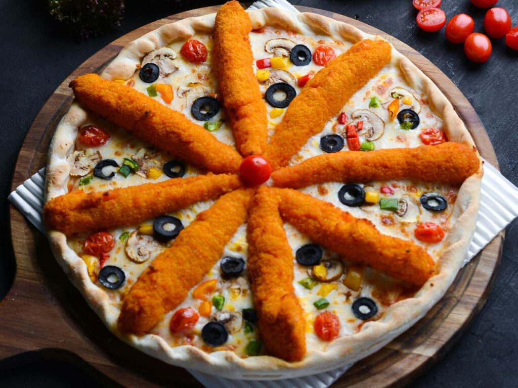 pizza decorated with mozzarella sticks