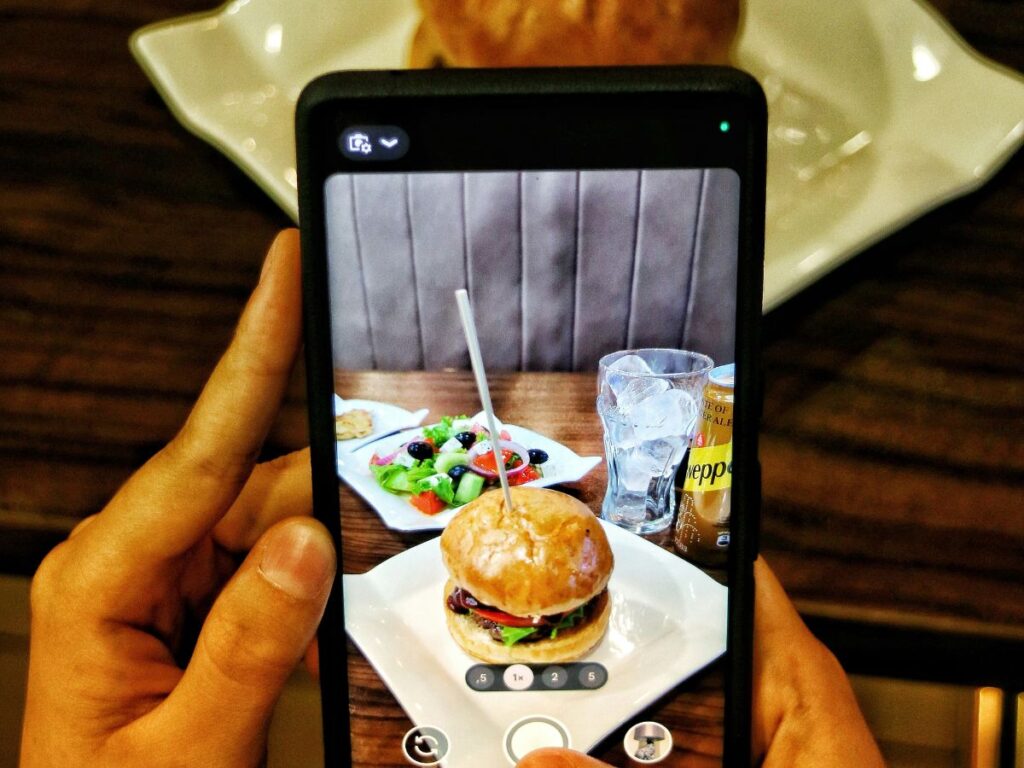 taking picture of a burger