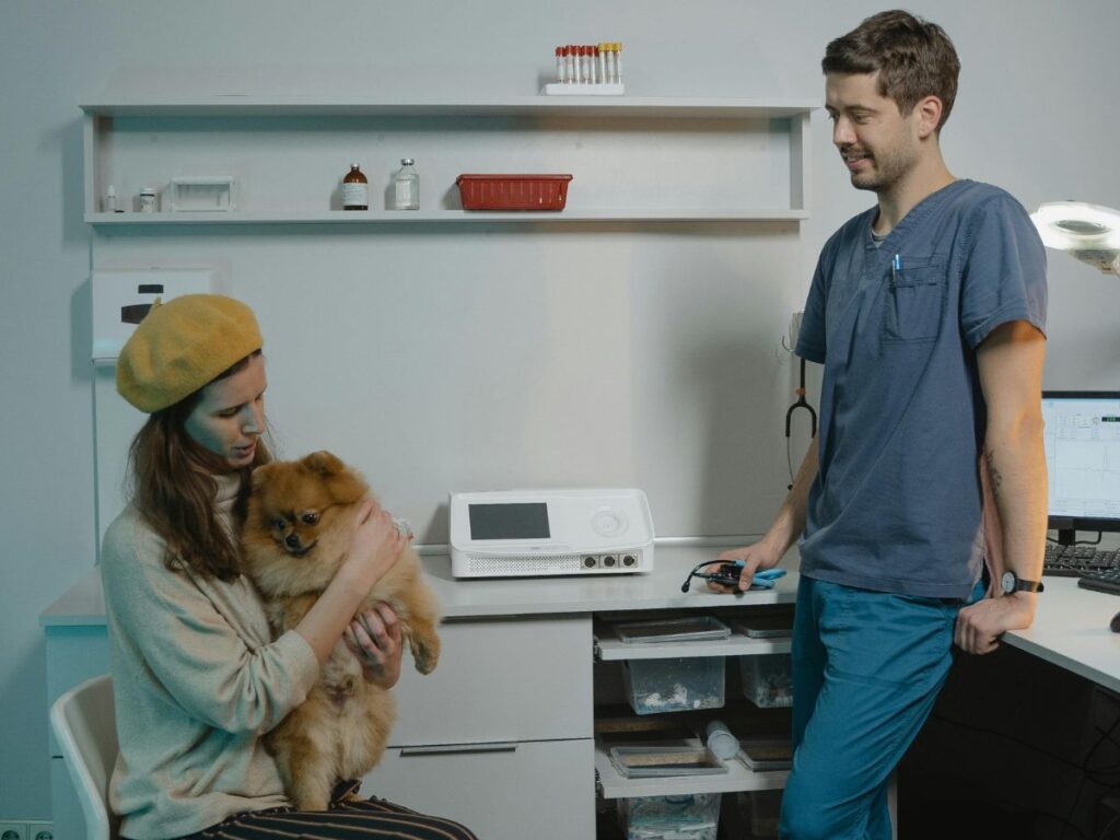 bear with its owner at vet