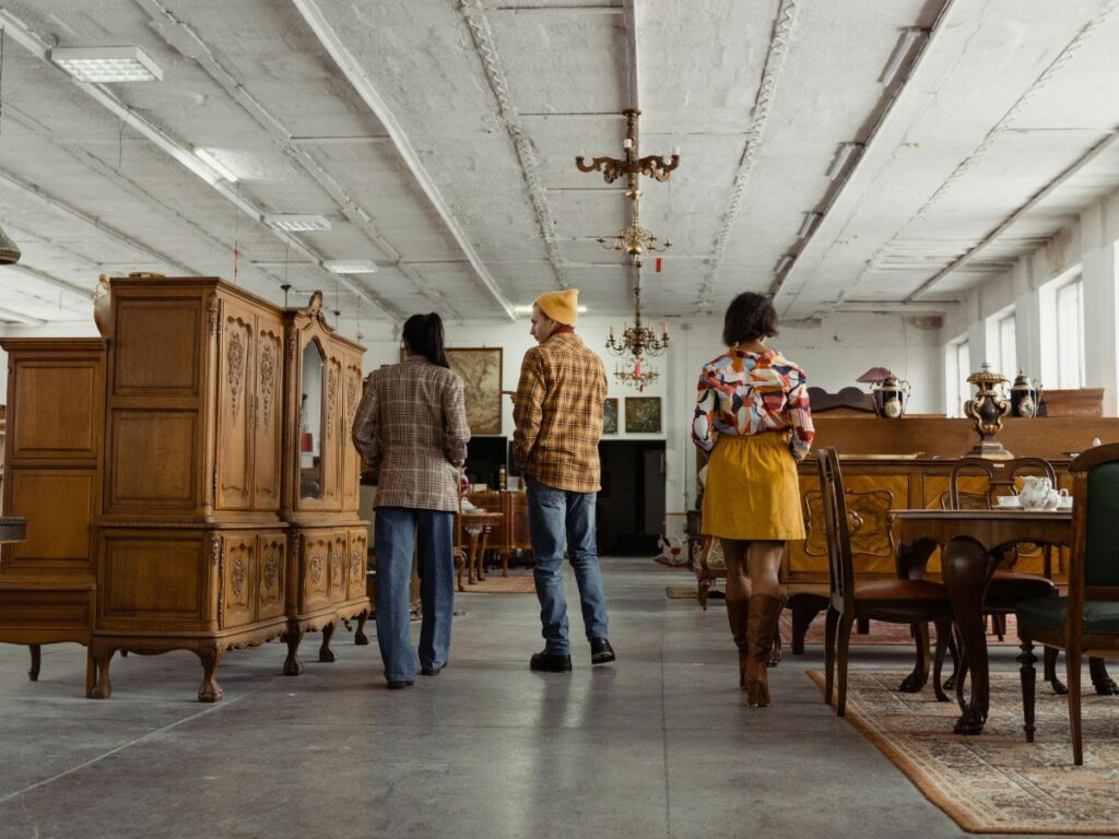 people in an antique furniture shop