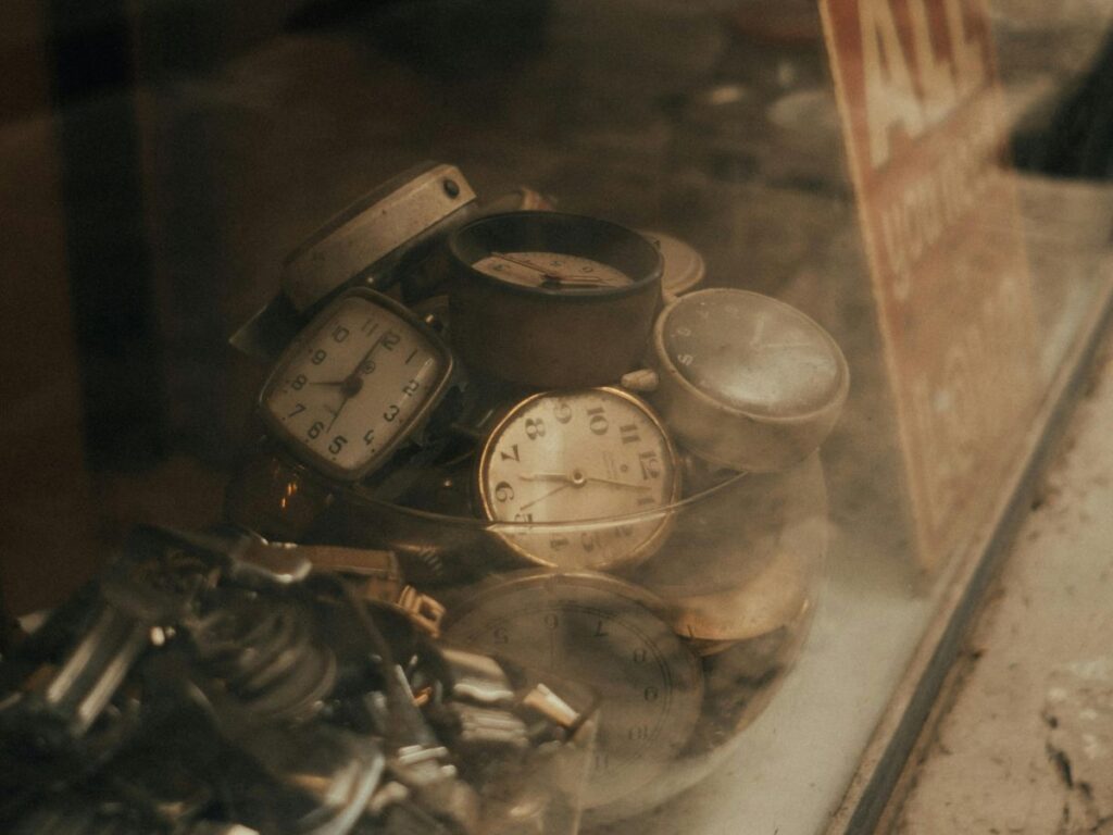 antique watches in a glass jar