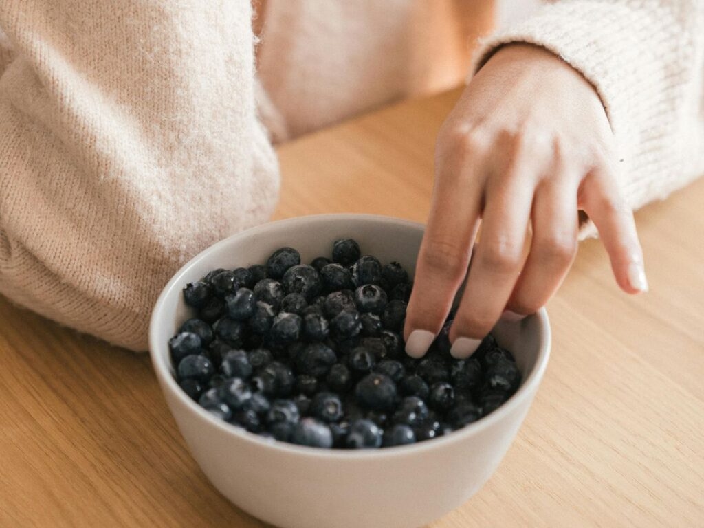 eating berries out of bowl