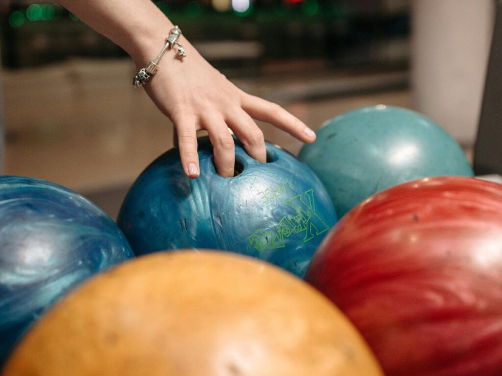 picking up a ball in bowling alley